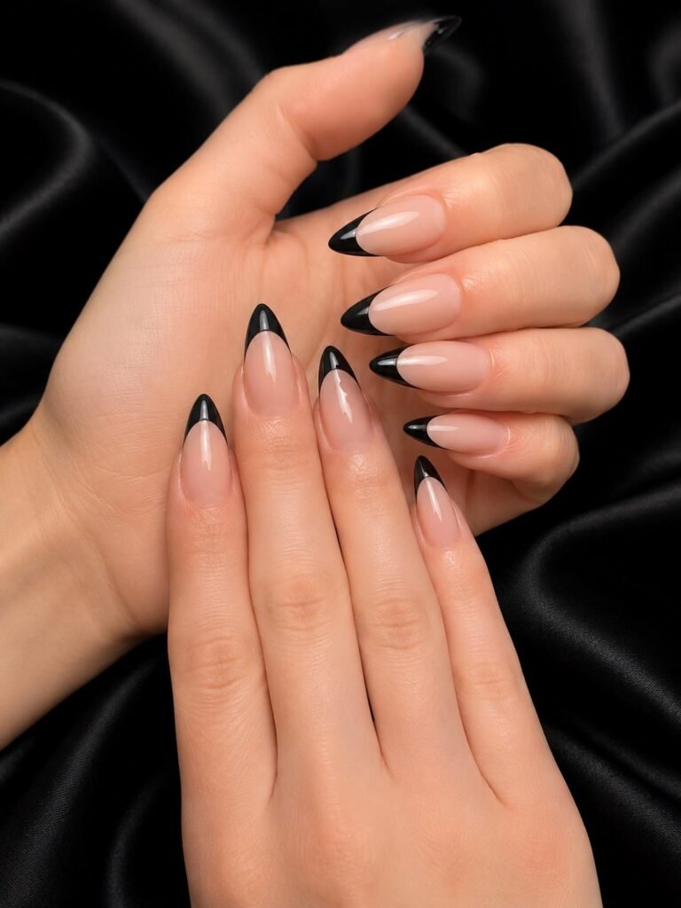 Gallery 20 Black French tip nails with glossy nude base at Darya’s Touch Manchester